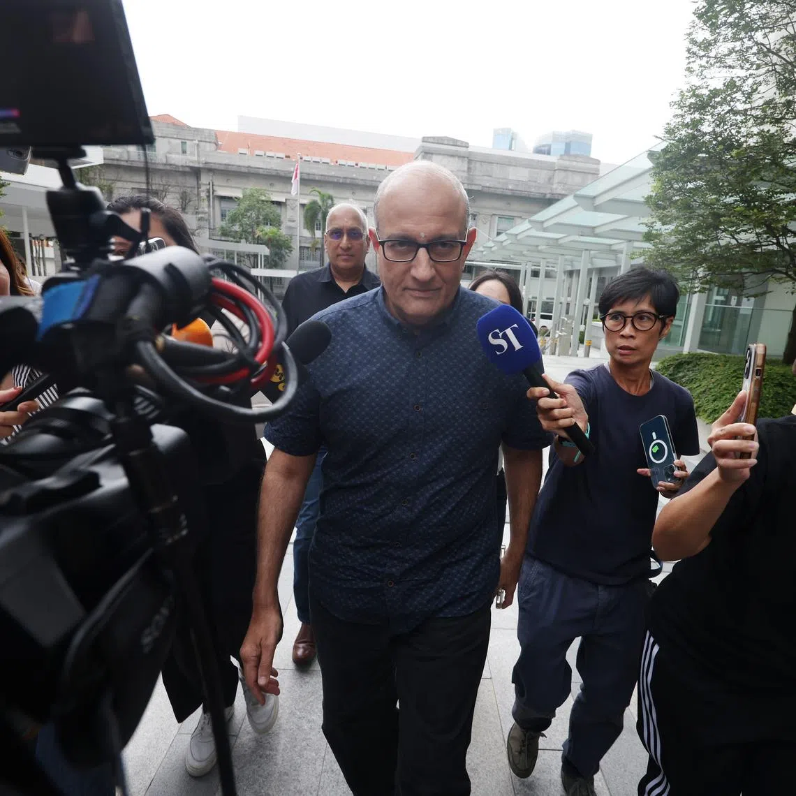 Former transport minister S. Iswaran arriving at the State Courts on Oct 7.