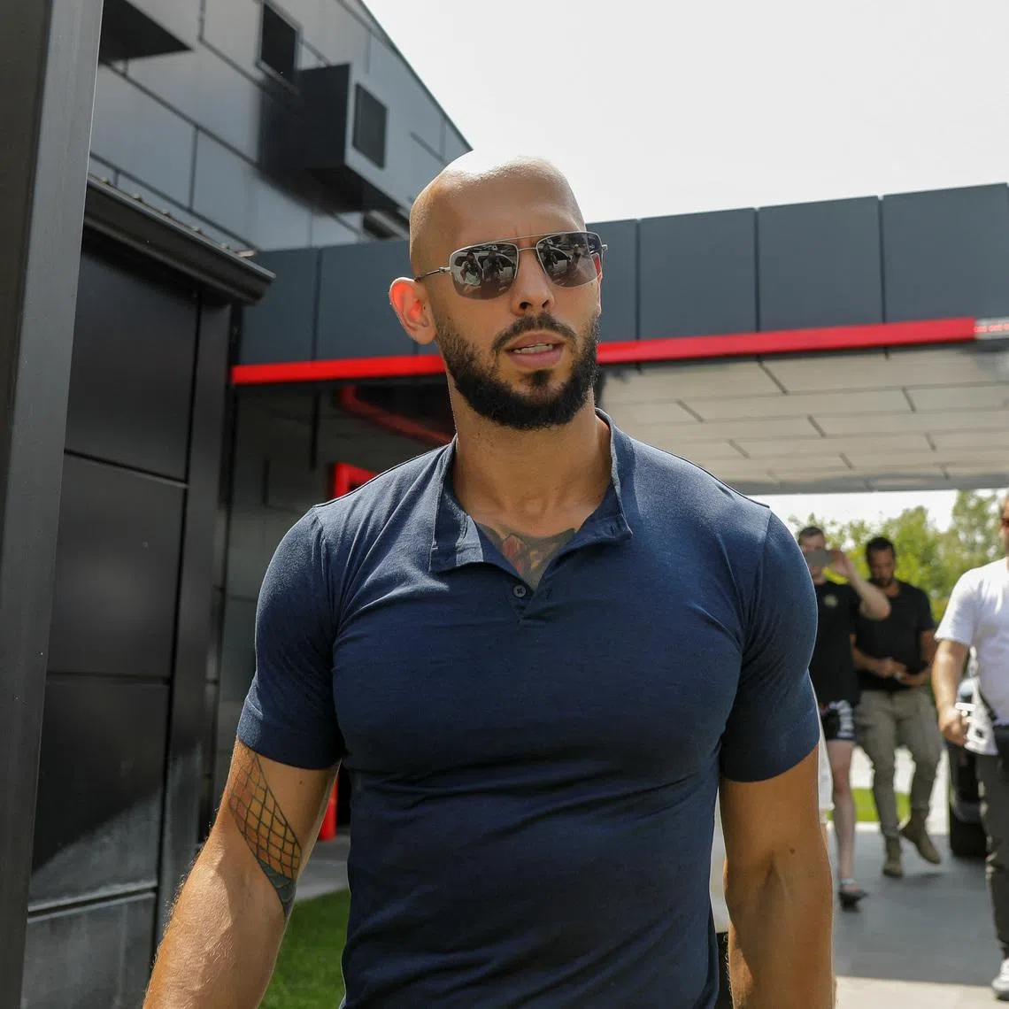 Andrew Tate delivers a press statement outside his house in Voluntari, Ilfov, Romania, August 4, 2023. Inquam Photos/George Calin via REUTERS