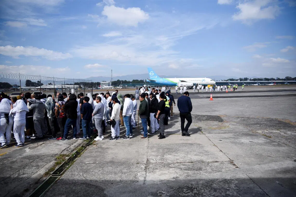 FILE PHOTO: Guatemalan migrants arrive at La Aurora Air Force Base on a deportation flight from the U.S., in Guatemala City, Guatemala, January 20, 2025. REUTERS/Cristina Chiquin/File Photo