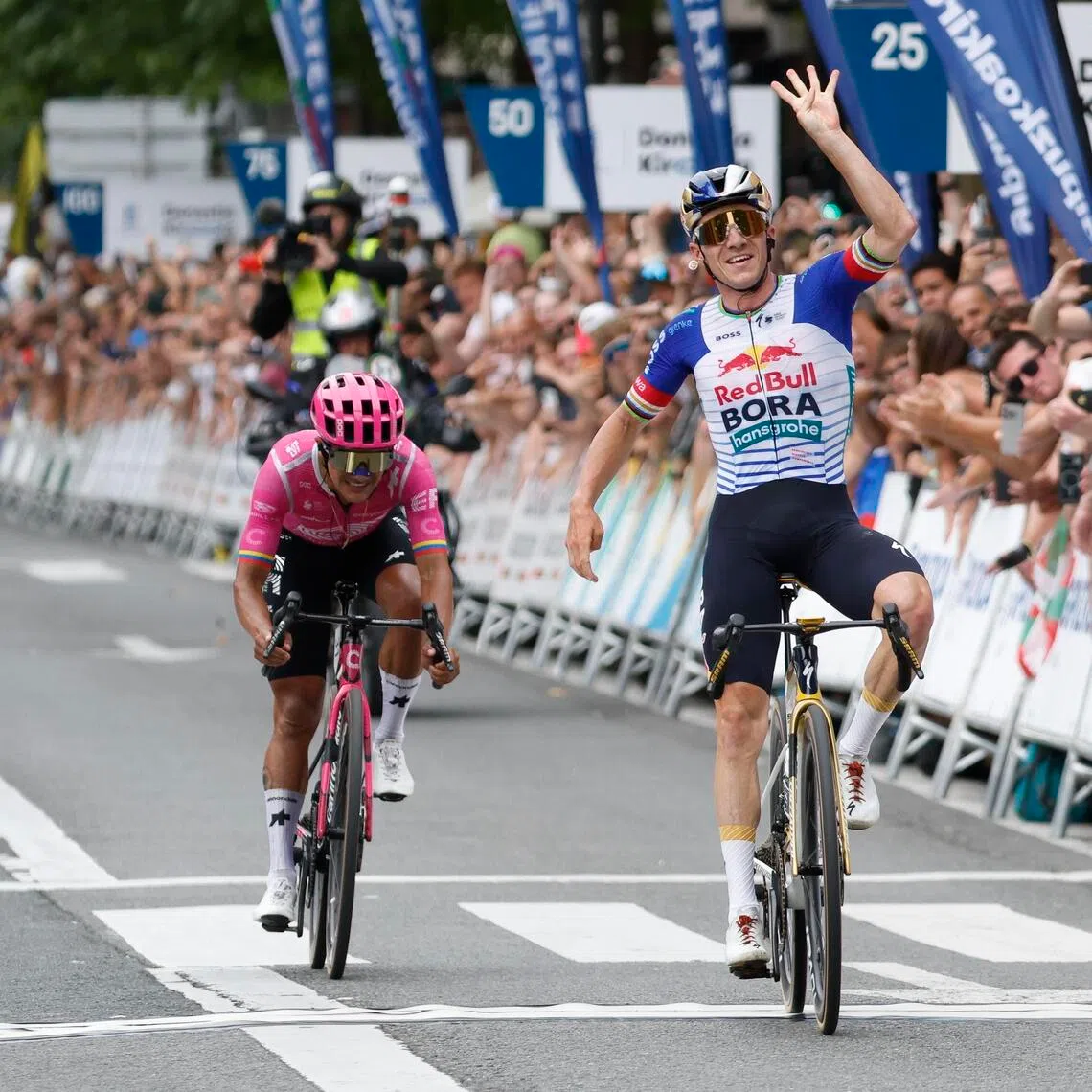 Belgian rider Remco Evenepoel (right) celebrating after out sprinting Ecuadorian Richard Carapaz to win the 45th edition of the San Sebastian Classic 2026 cycling race in San Sebastian, Spain, on Aug 1.