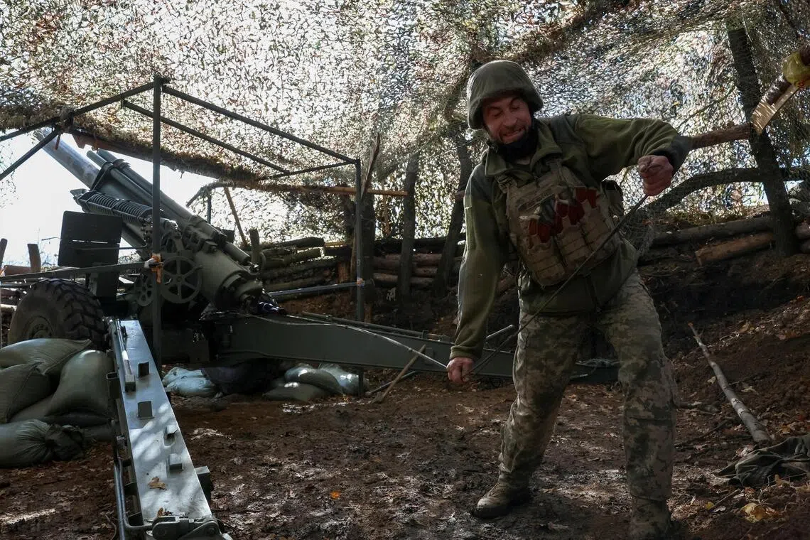 A Ukrainian artilleryman firing an M114 self-propelled howitzer towards Russian troops, near the front-line town of Pokrovsk, on Oct 15.