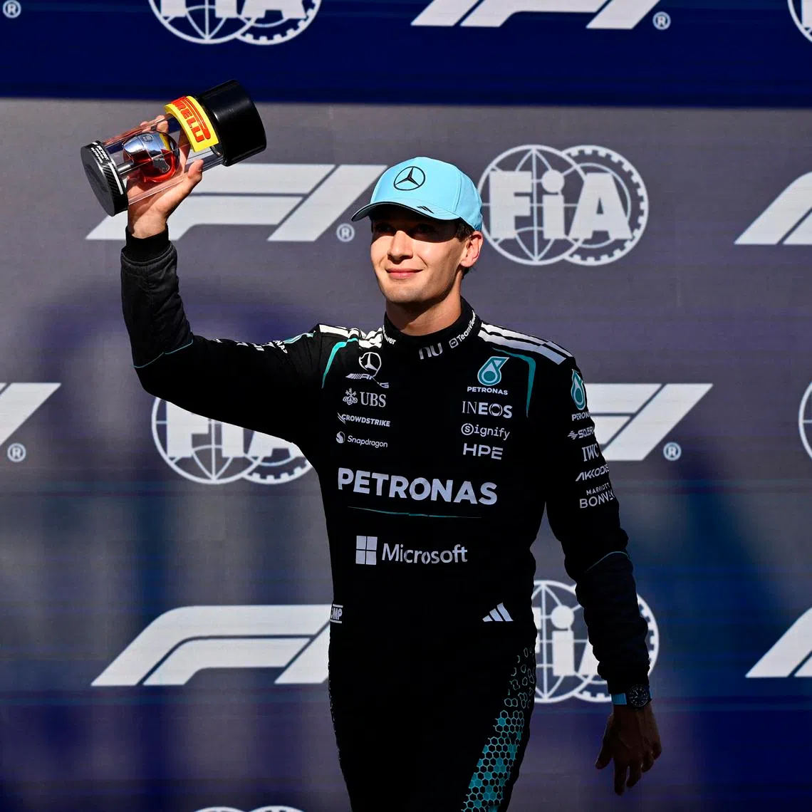 Formula One F1 - Canadian Grand Prix - Circuit Gilles Villeneuve, Montreal, Quebec, Canada - May 22, 2026 Mercedes' George Russell celebrates after qualifying in pole position for the sprint race REUTERS/Jennifer Gauthier