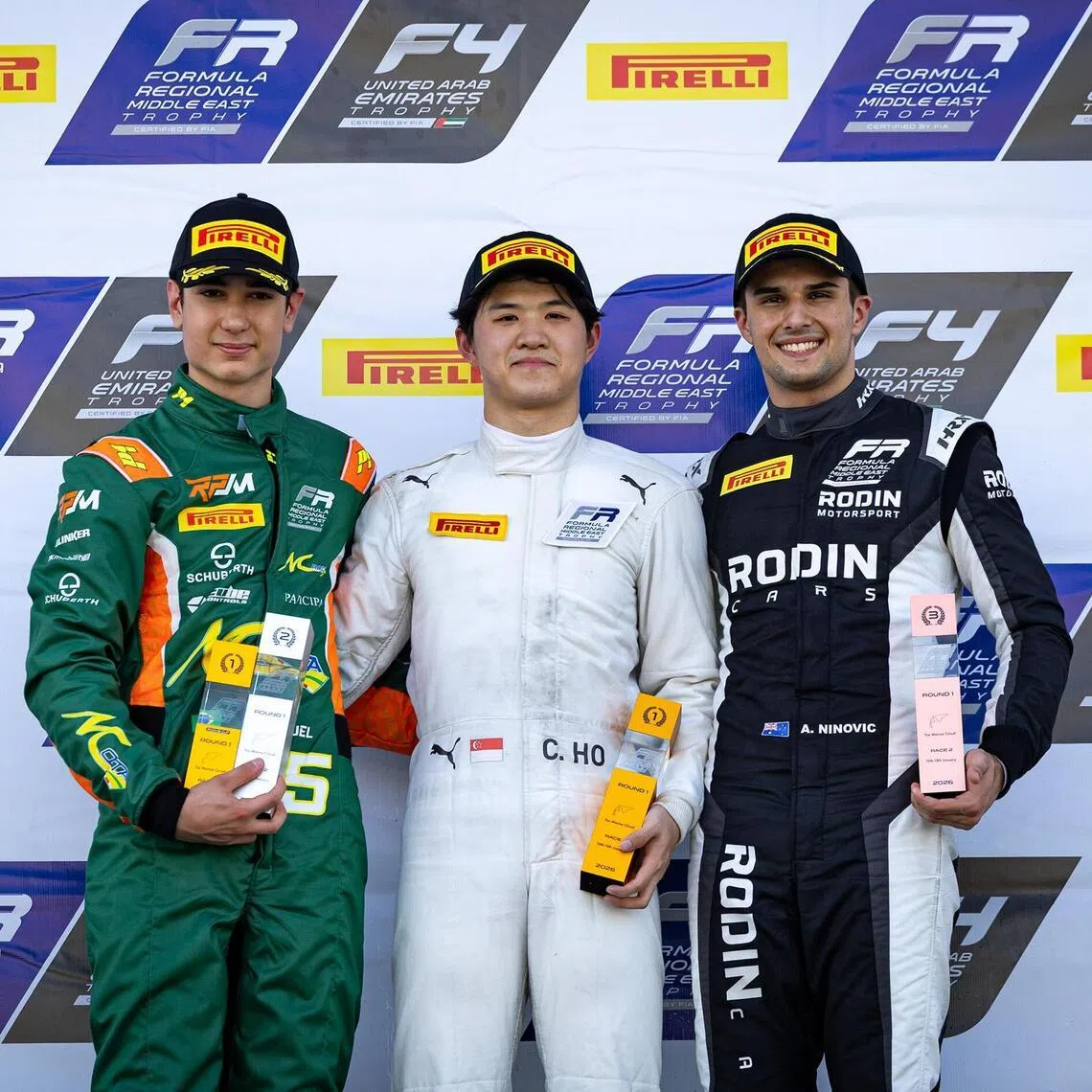 Singapore's Christian Ho (centre) finished ahead of RPM's Miguel Costa (left) and Rodin's Alex Ninovic in Race 2 of the first round of the Formula Regional Middle East Trophy.