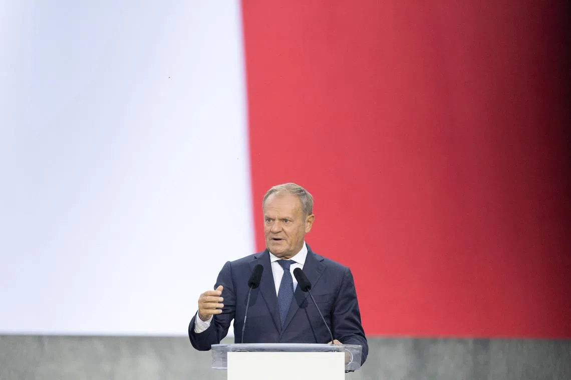FILE PHOTO: Polish Prime Minister Donald Tusk speaks during the ceremony marking the 86th anniversary of Nazi Germany's invasion of Poland, at the Westerplatte Monument in Gdansk, Poland, September 1, 2025. REUTERS/Lukasz Glowala/File Photo