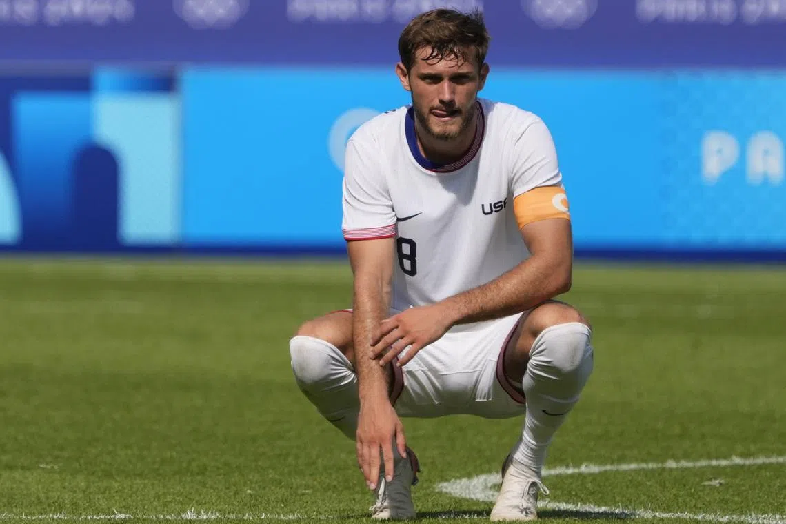 FILE PHOTO: Aug 2, 2024; Paris, France; United States midfielder Tanner Tessmann (8) reacts after losing to Morocco in a men's football quarterfinal during the Paris 2024 Olympic Summer Games at Parc des Princes. Mandatory Credit: Andrew P. Scott-USA TODAY Sports/File photo