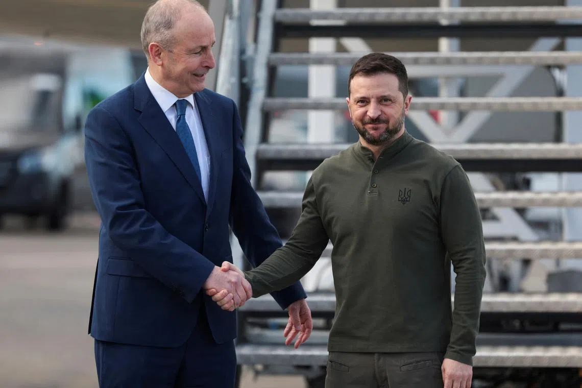 Ireland's Taoiseach (Prime Minister) Micheal Martin greets Ukraine's President Volodymyr Zelenskiy at Shannon airport ahead of a bilateral meeting, in Shannon, Ireland, February 27, 2025. REUTERS/Emilija Jefremova