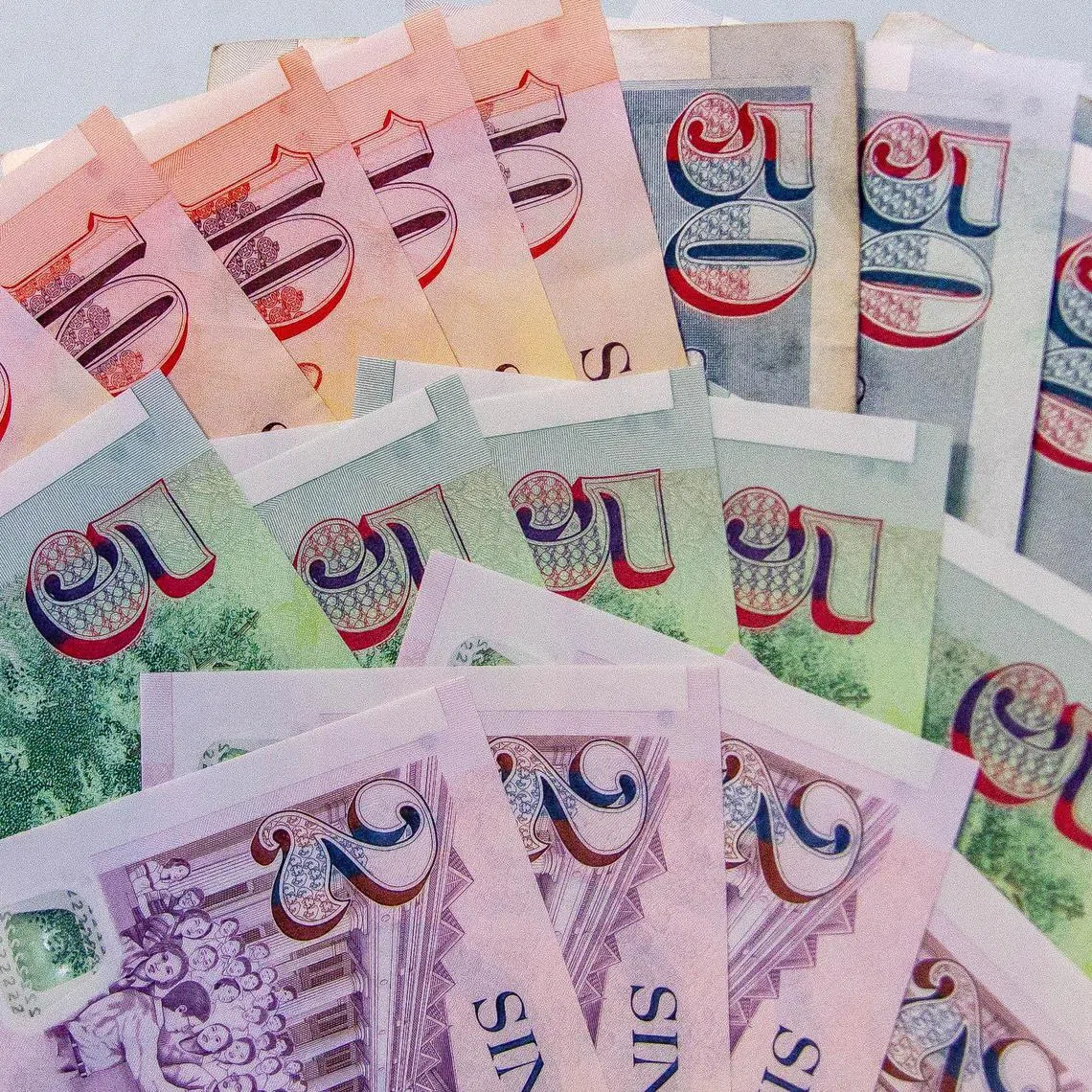Singapore dollar notes in 2, 5, 10 and 50 denomination.