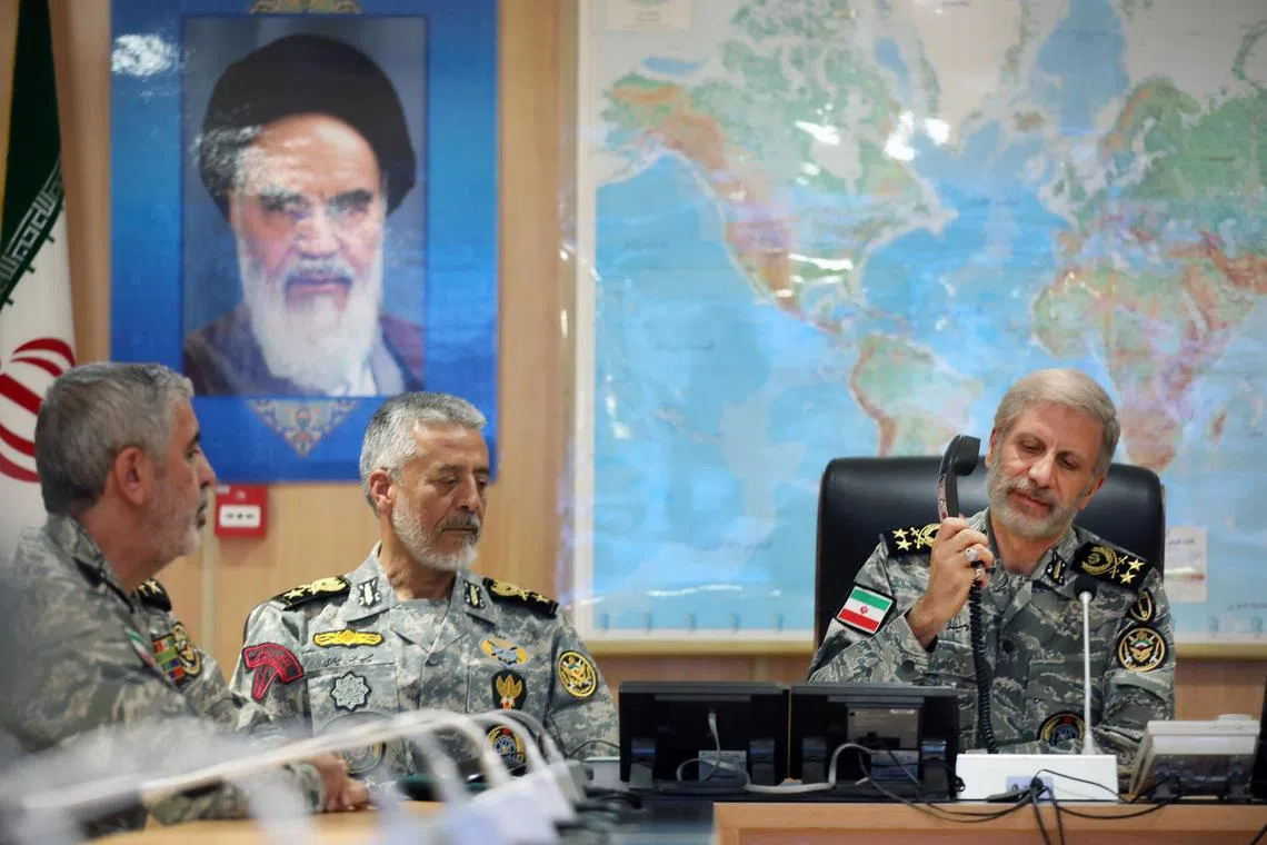epa12192366 A handout photo made available by the Iranian Army Media Office on 23 June 2025, shows the commander-in-chief of the Iranian Army Amir Hatami (R) attending a meeting in the Iranian Army's War Command Room, in an unknown location. The US forces struck three of Iran's key nuclear sites: Natanz, Isfahan and Fordo, US President Trump announced on 21 June. Israel and Iran have been exchanging fire since Israel launched strikes across Iran on 13 June 2025 as part of Operation 'Rising Lion.'  EPA-EFE/IRANIAN ARMY MEDIA OFFICE HANDOUT HANDOUT EDITORIAL USE ONLY/NO SALES