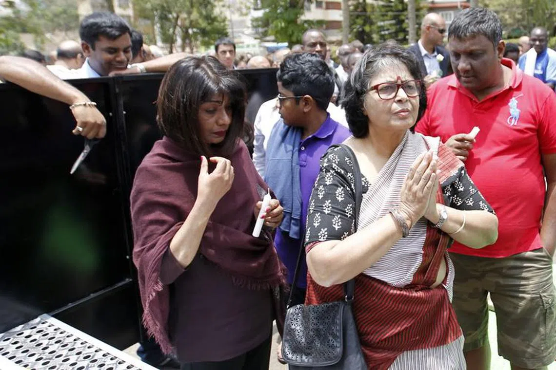 Survivors and relatives of the victims attend the first anniversary memorial service of the Westgate shopping mall terrorist attack in Kenya's capital Nairobi, September 21, 2014. REUTERS/Thomas Mukoya/File Photo
