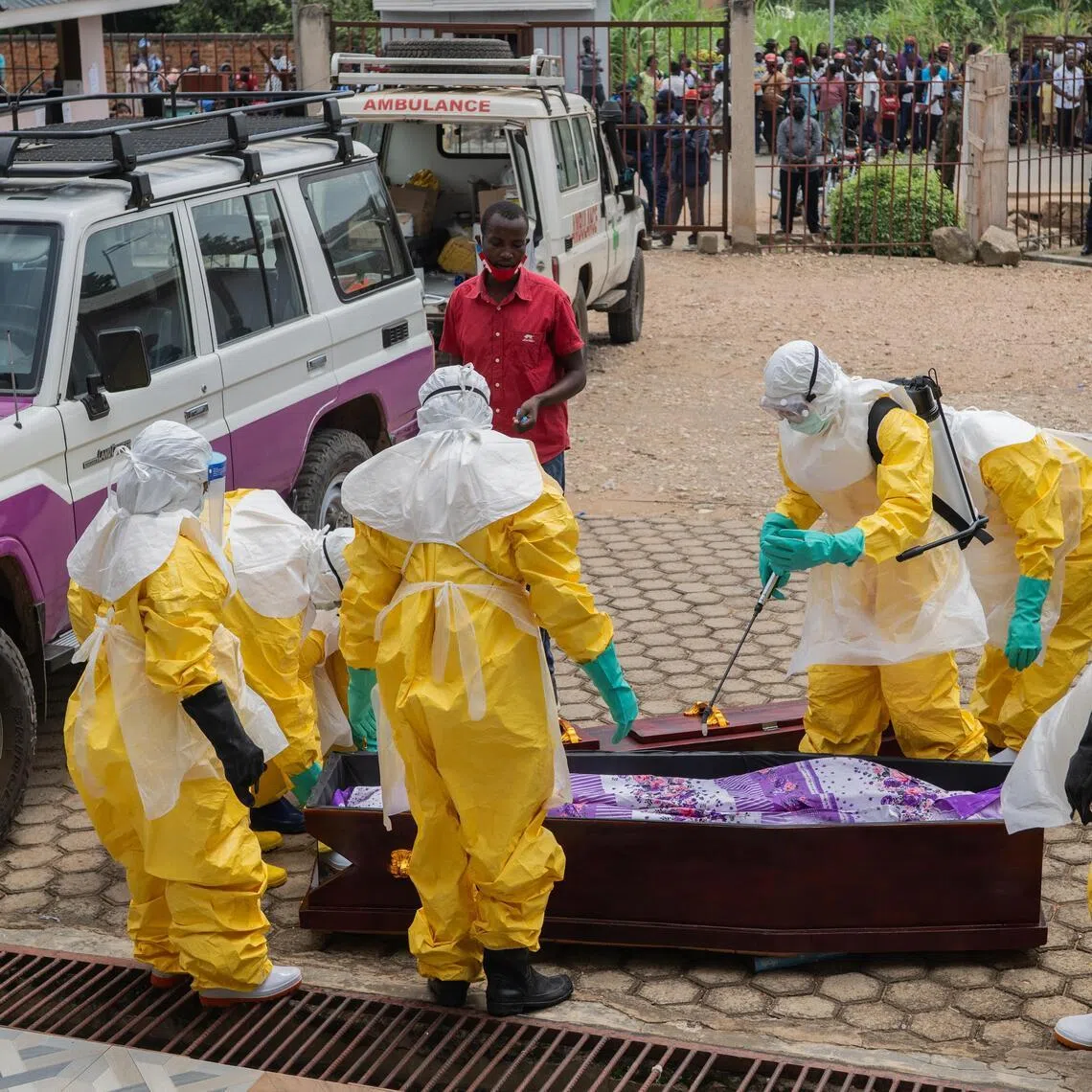 Health workers wearing full personal protective equipment (PPE) prepare to transport the body of an Ebola victim for a safe burial in Ituri province, Democratic Republic of the Congo, on May 23.