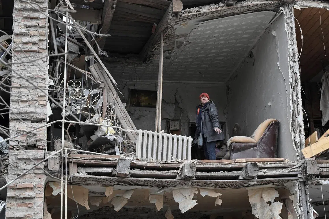 A resident standing in her flat after her apartment building was hit by a Russian missile strike, in Zaporizhzhia, Ukraine, on Jan 23.