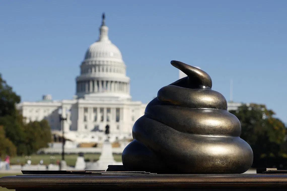 WASHINGTON, DC - OCTOBER 24: A satirical art installation that "honors" those who participated in the Jan 6, 2021 riot at the U.S. Capitol on the National Mall in on October 24, 2024 in Washington, DC. The temporary art installation depicts an emoji-style poop on top of then-Speaker of the House Nancy Pelosi’s desk.   Kevin Dietsch/Getty Images/AFP (Photo by Kevin Dietsch / GETTY IMAGES NORTH AMERICA / Getty Images via AFP)