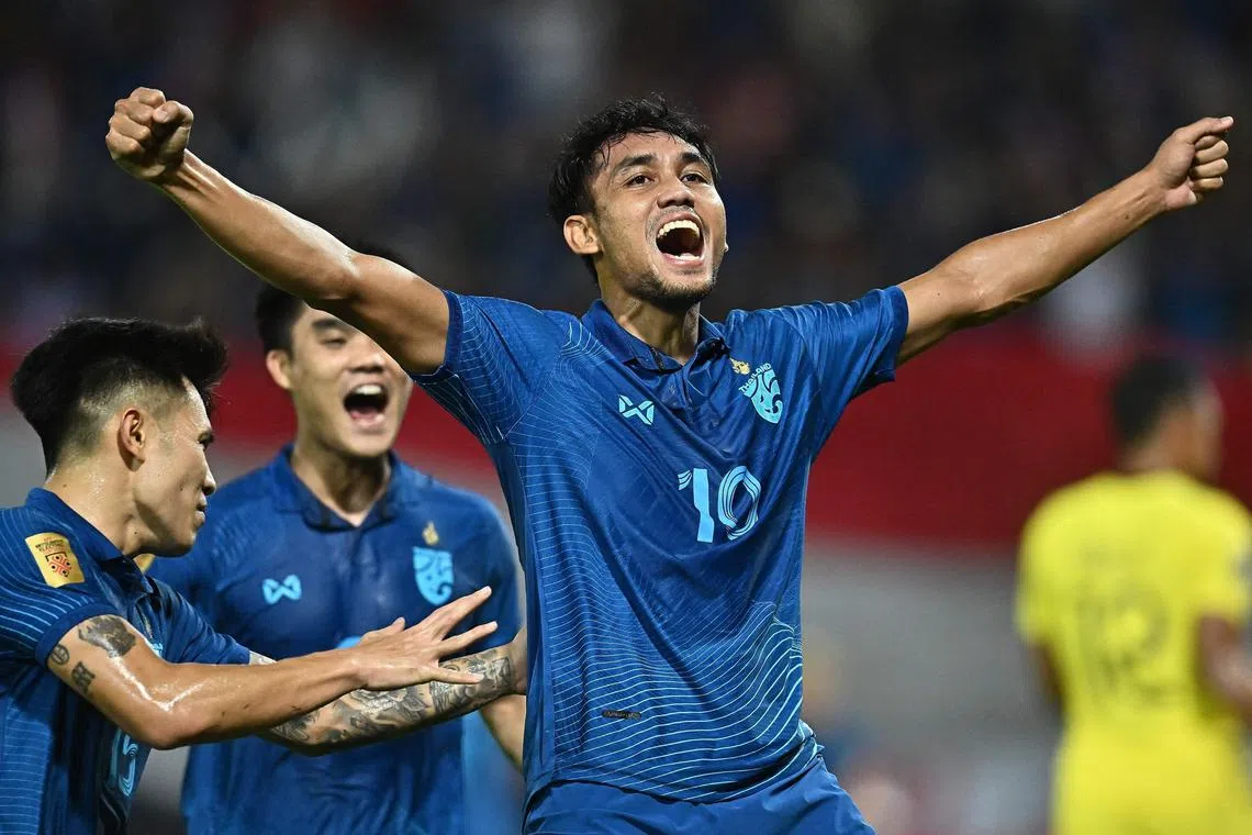 Thailand's Teerasil Dangda celebrates after scoring the first goal against Malaysia in the second leg of the AFF Championship semi-finals.