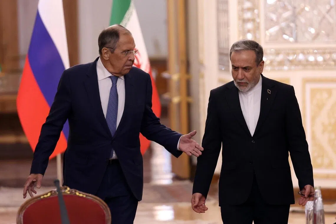 Russian Foreign Minister Sergei Lavrov (left) and his Iranian counterpart Abbas Araghchi at a joint press conference in Tehran on Oct 19.