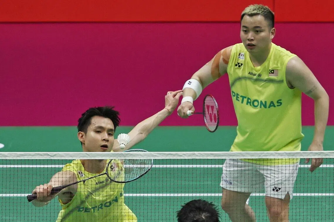 Soh Wooi Yik (left) and Aaron Chia during their doubles final against Liang Wei Keng and Wang Chang of China at the BWF World Championship in New Delhi, India on Aug 23.