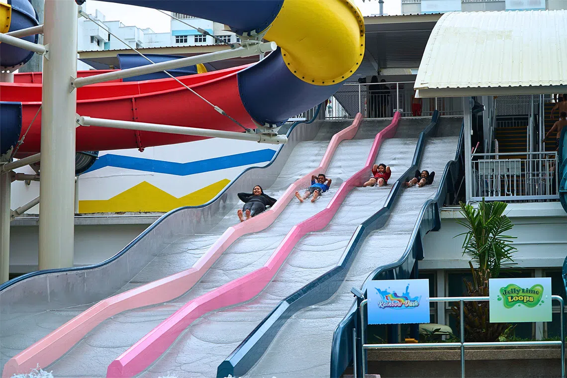 ActiveSG public swimming pool, kids going down water slide