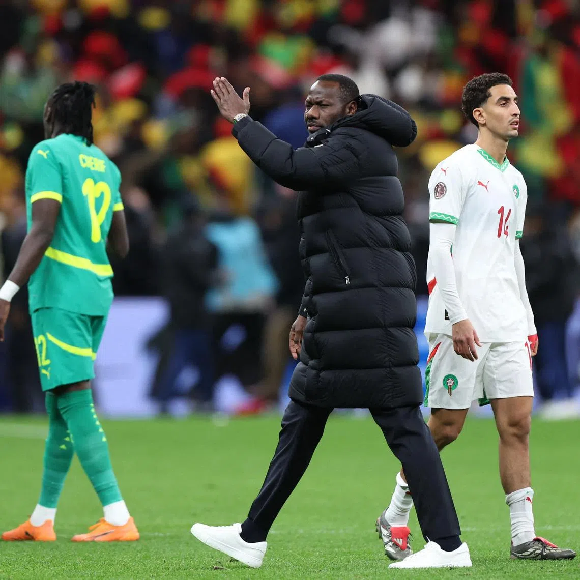 Soccer Football - CAF Africa Cup of Nations - Morocco 2025 - Final - Senegal v Morocco - Prince Moulay Abdellah Stadium, Rabat, Morocco - January 18, 2026 Senegal coach Pape Thiaw gestures for his players to leave the pitch after a penalty is awarded to Morocco REUTERS/Amr Abdallah Dalsh