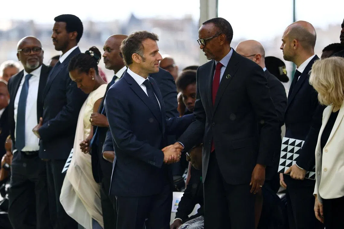 French President Emmanuel Macron shakes hands with Rwandan President Paul Kagame after the inauguration ceremony of a double stele artwork by artist Grada Kilomba, a new memorial site paying tribute to the victims of the Rwanda's genocide at the Habib-Bourgiba esplanade along the River Seine, in Paris, France, June 2, 2026. REUTERS/Sarah Meyssonnier/Pool