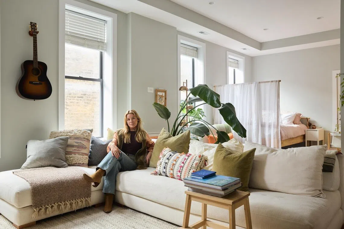 Ms Victoria Sus, a Kindred member who said her worries about home swapping were assuaged by the platform's guidelines and generous insurance policy, at home in Chicago.