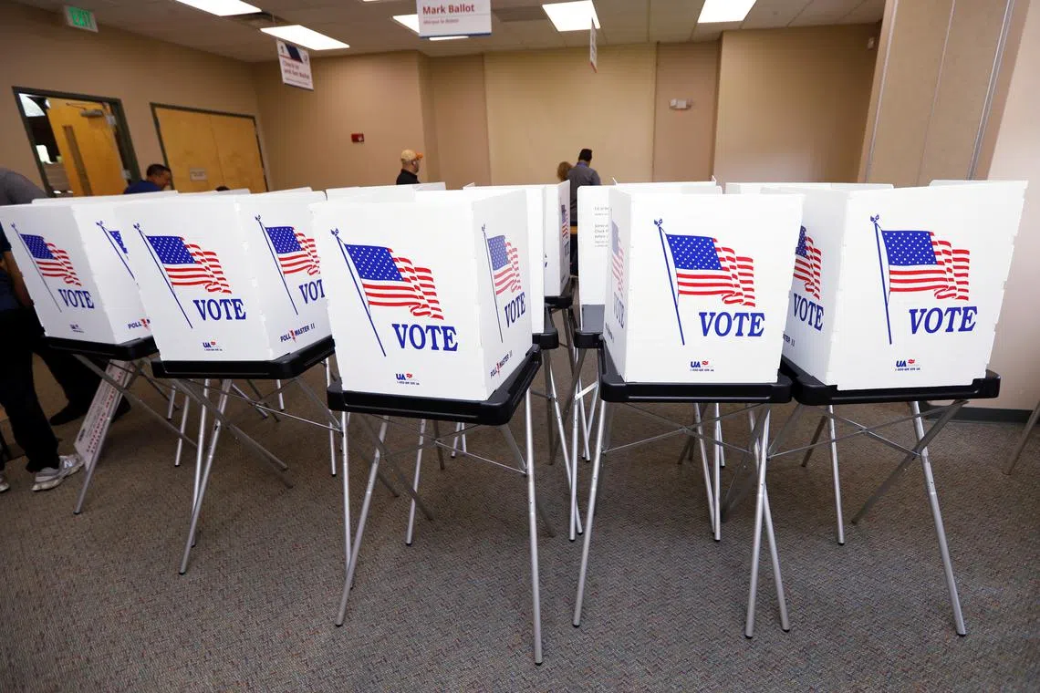 FILE PHOTO: Poll workers with the Hillsborough County Supervisor of Elections Office, work to setup early voting equipment at the Seffner-Mango Branch Library in Seffner, Florida, U.S., August 2, 2024. REUTERS/Octavio Jones/File photo
