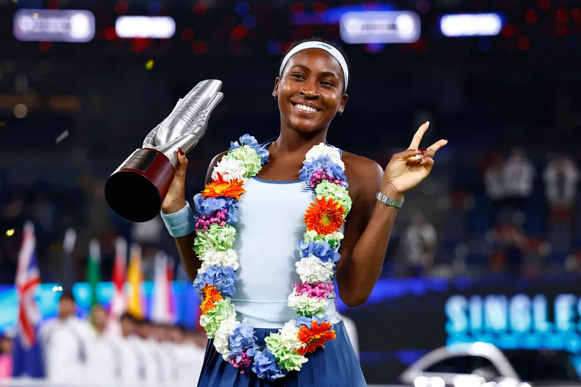 Tennis - WTA 1000 - Wuhan Open - Optics Valley International Tennis Center, Wuhan, China - October 12, 2025 Coco Gauff of the U.S. poses with the trophy after winning the final against Jessica Pegula of the U.S. REUTERS/Tingshu Wang