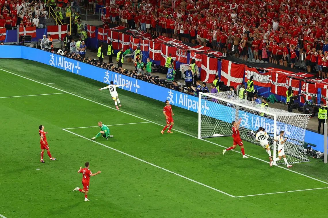 Soccer Football - Euro 2024 - Round of 16 - Germany v Denmark - Dortmund BVB Stadion, Dortmund, Germany - June 29, 2024  Germany's Jamal Musiala celebrates scoring their second goal REUTERS/Bernadett Szabo