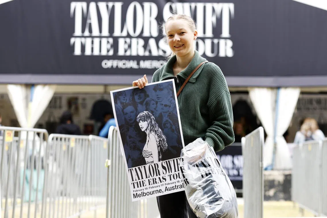 A fan in Melbourne shows off the Taylor Swift The Eras Tour merchandise she purchased on Feb 14, 2024. 