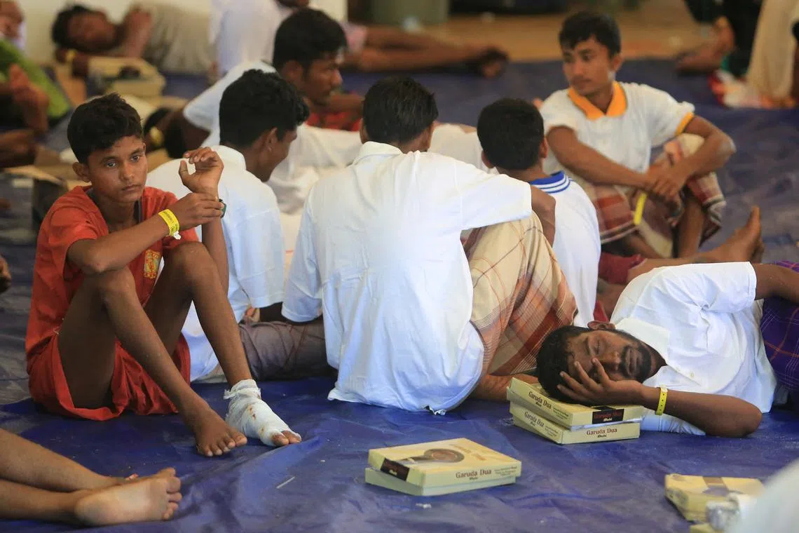 Rohingya refugees rest at the temporary shelter in Suak Nie village following their arrival in the waters of West Aceh, Aceh province, Indonesia, March 22, 2024, in this photo taken by Antara Foto. Antara Foto/Syifa Yulinnas/via REUTERS/File Photo