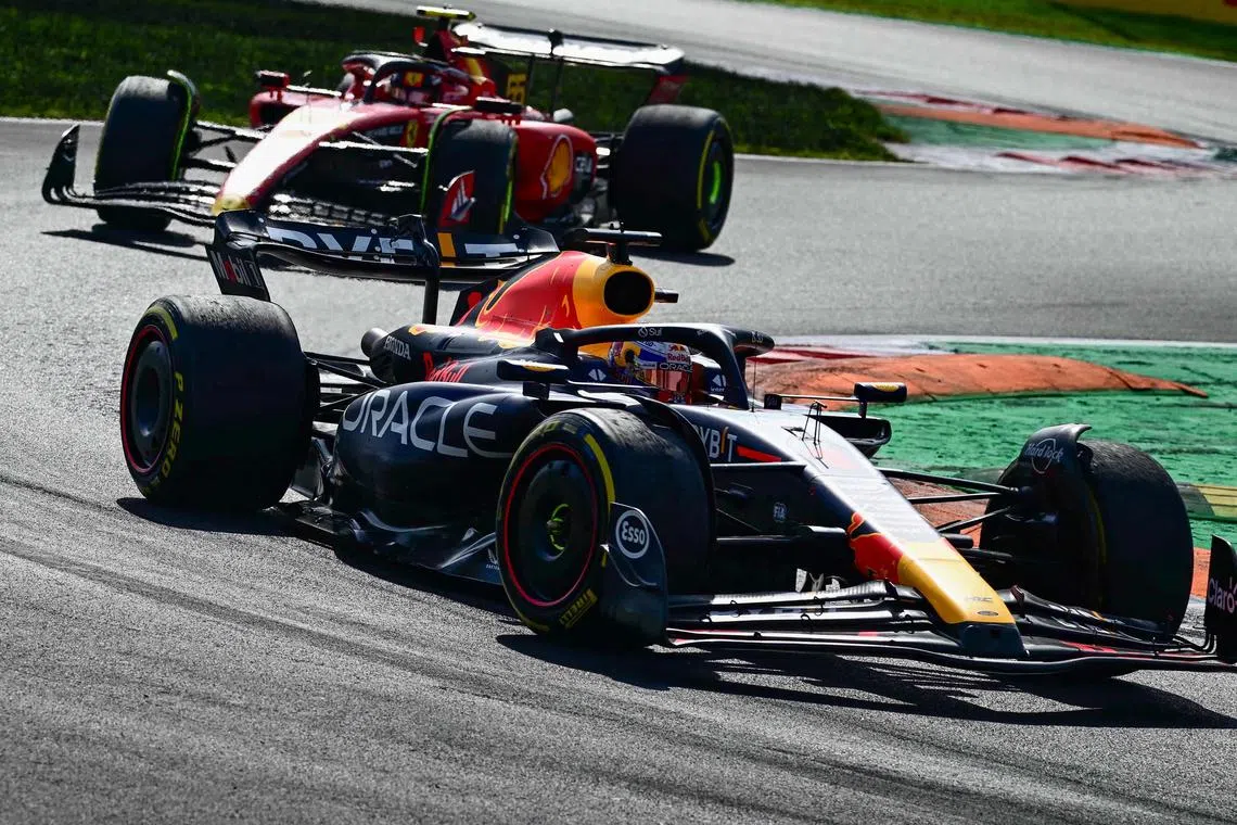 Red Bull's Max Verstappen leading the race in front of Ferrari's Carlos Sainz during the Italian Grand Prix.
