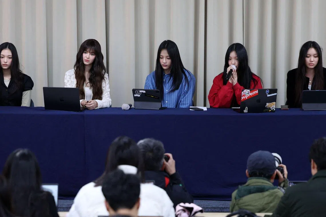 South Korean K-pop girl group NewJeans members (from left) Haerin, Danielle, Minji, Hanni and Hyein attend a press conference in Seoul on November 28, 2024 to announce their departure from their label Ador.