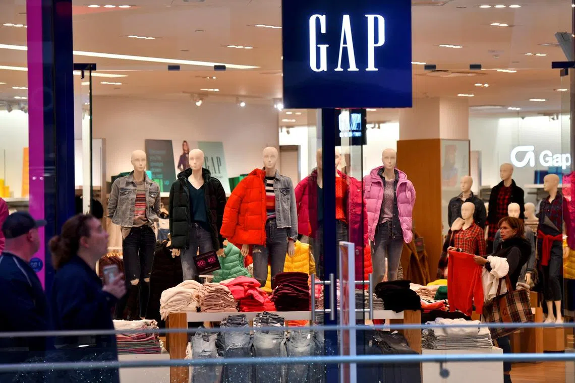 FILE PHOTO: A woman shops at a Gap store during pre-Thanksgiving and Christmas holiday shopping at the King of Prussia Mall in King of Prussia, Pennsylvania, U.S. November 22, 2019. REUTERS/Mark Makela/File Photo