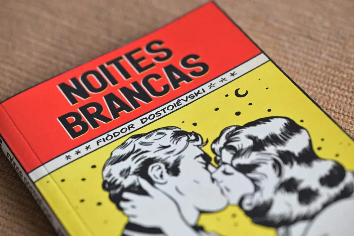 View of pocket book version of "White Nights" of Russian writer Fyodor Dostoevsky, in Sao Paulo, Brazil on August 25, 2026. "White Nights", the short story by Russian writer Fyodor Dostoevsky about a "dreamer" who falls deeply in love with a young woman he meets while strolling through the streets of St. Petersburg in the mid-19th century, has become one of Brazil's best-selling books. (Photo by Nelson ALMEIDA / AFP)
