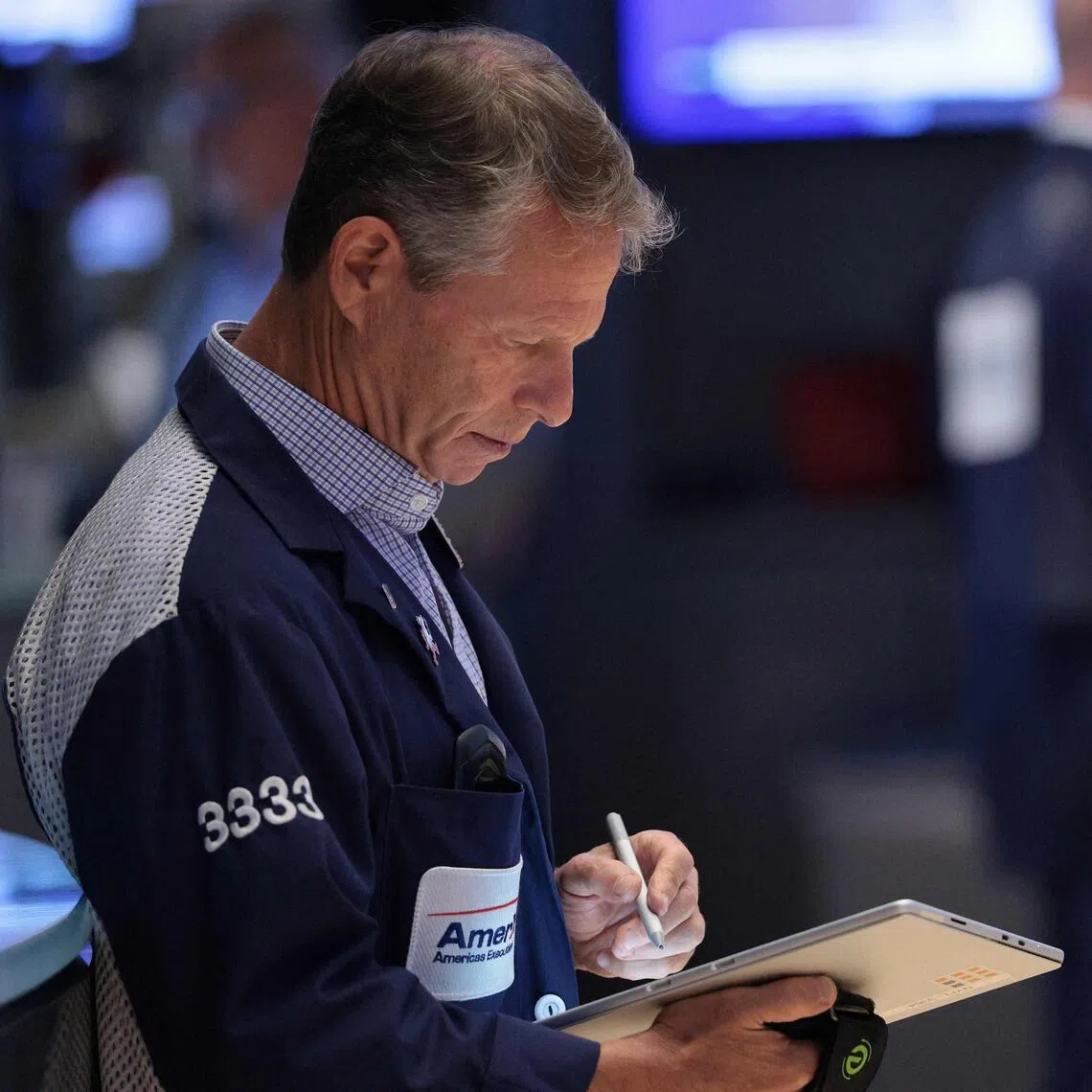 Traders working on the floor of the New York Stock Exchange during morning trading on July 8, in New York City.