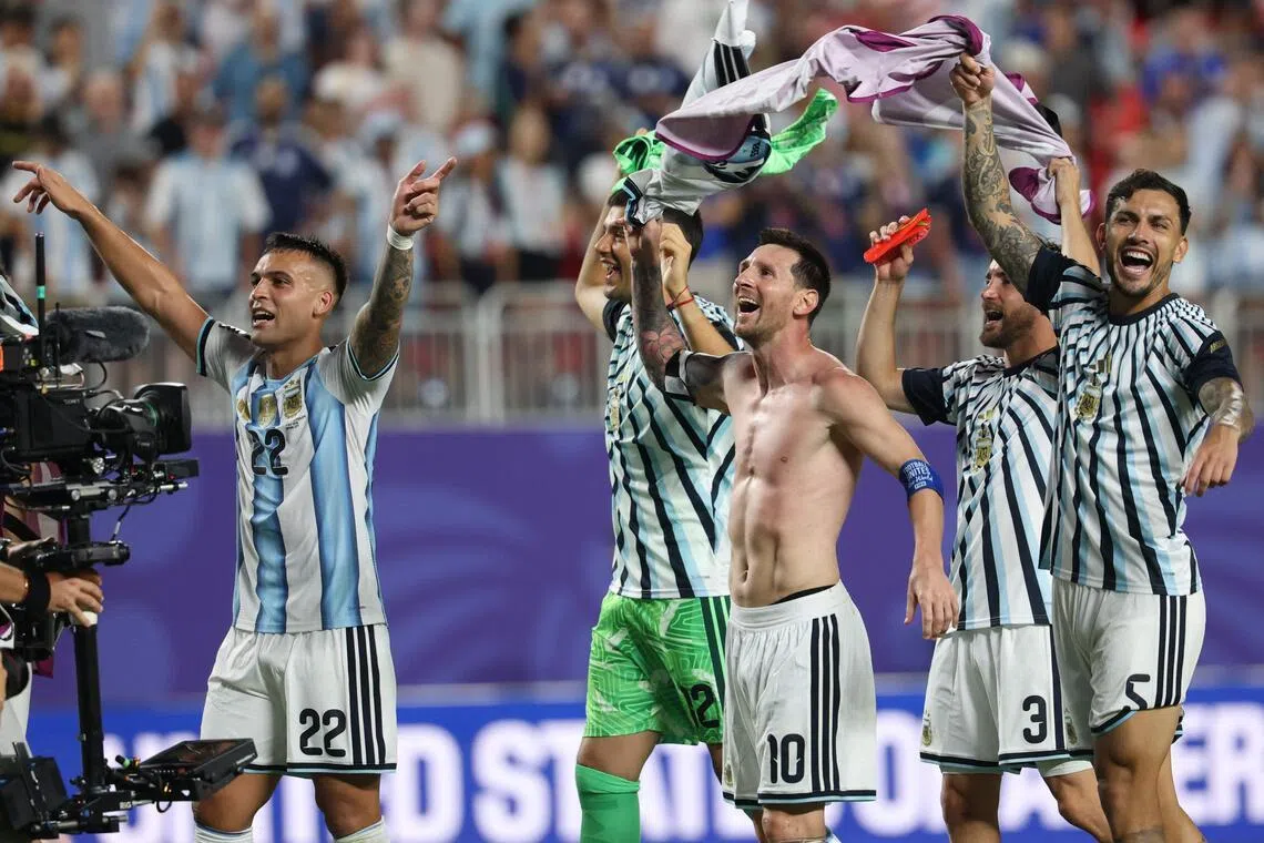 (L-R) Argentina's forward #22 Lautaro Martinez, goalkeeper #12 Geronimo Rulli, forward #10 Lionel Messi, defender #03 Nicolas Tagliafico and midfielder #05 Leandro Paredes celebrate the 3-1 victory over Switzerland during the 2026 World Cup football tournament quarter-final match between Argentina and Switzerland at the Kansas City Stadium in Kansas City on July 11, 2026.  (Photo by Odd ANDERSEN / AFP)