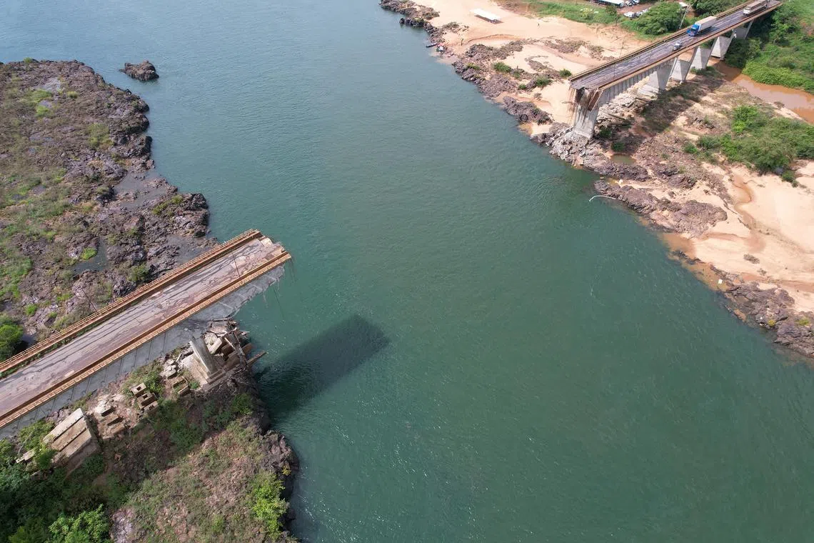 A drone view shows a collapsed bridge between Aguiarnopolis and Estreito, Brazil, December 24, 2024. REUTERS/Mauricio Marinho