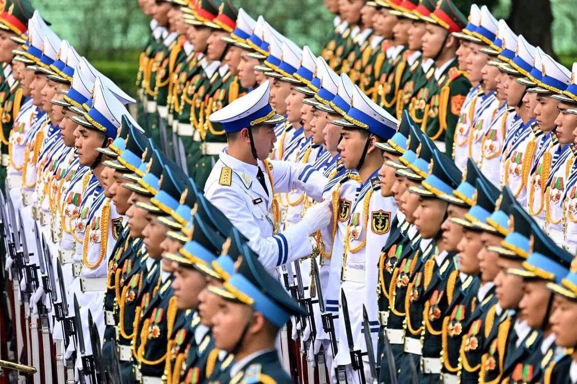 Members of a Vietnamese honour guard preparing ahead of a welcome ceremony for South Korean President Lee Jae Myung at the Presidential Palace in Hanoi on April 22.