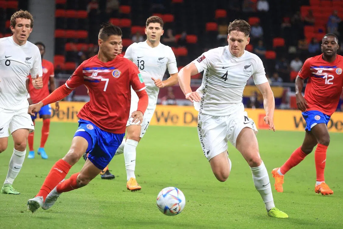 Soccer Football - FIFA World Cup Qualifier - Costa Rica v New Zealand - Al Rayyan Stadium, Al Rayyan, Qatar - June 14, 2022 Costa Rica's Anthony Contreras in action with New Zealand's Nando Pijnaker. REUTERS/Mohammed Dabbous