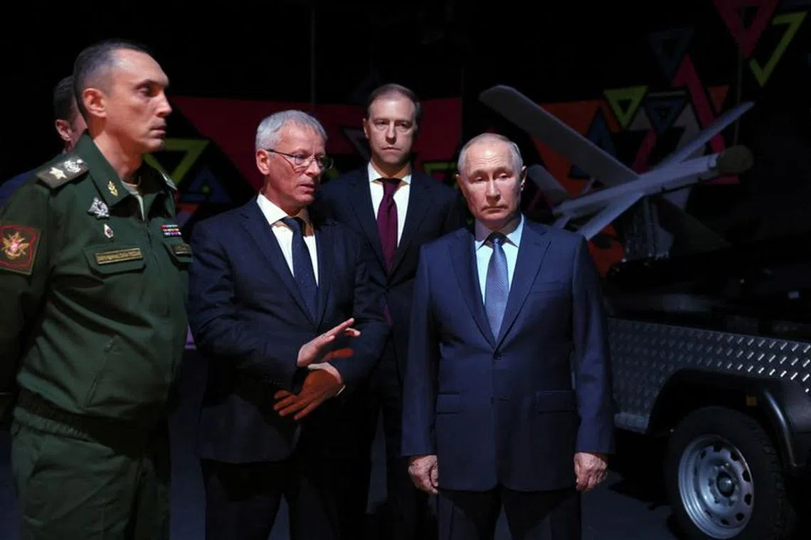 Russian President Vladimir Putin, accompanied by Deputy Prime Minister Denis Manturov, Deputy Defence Minister Alexei Krivoruchko and other officials, attends the Gunsmith Forum in the city of Izhevsk, Russia September 19, 2023. Sputnik/Mikhail Metzel/Pool via REUTERS
