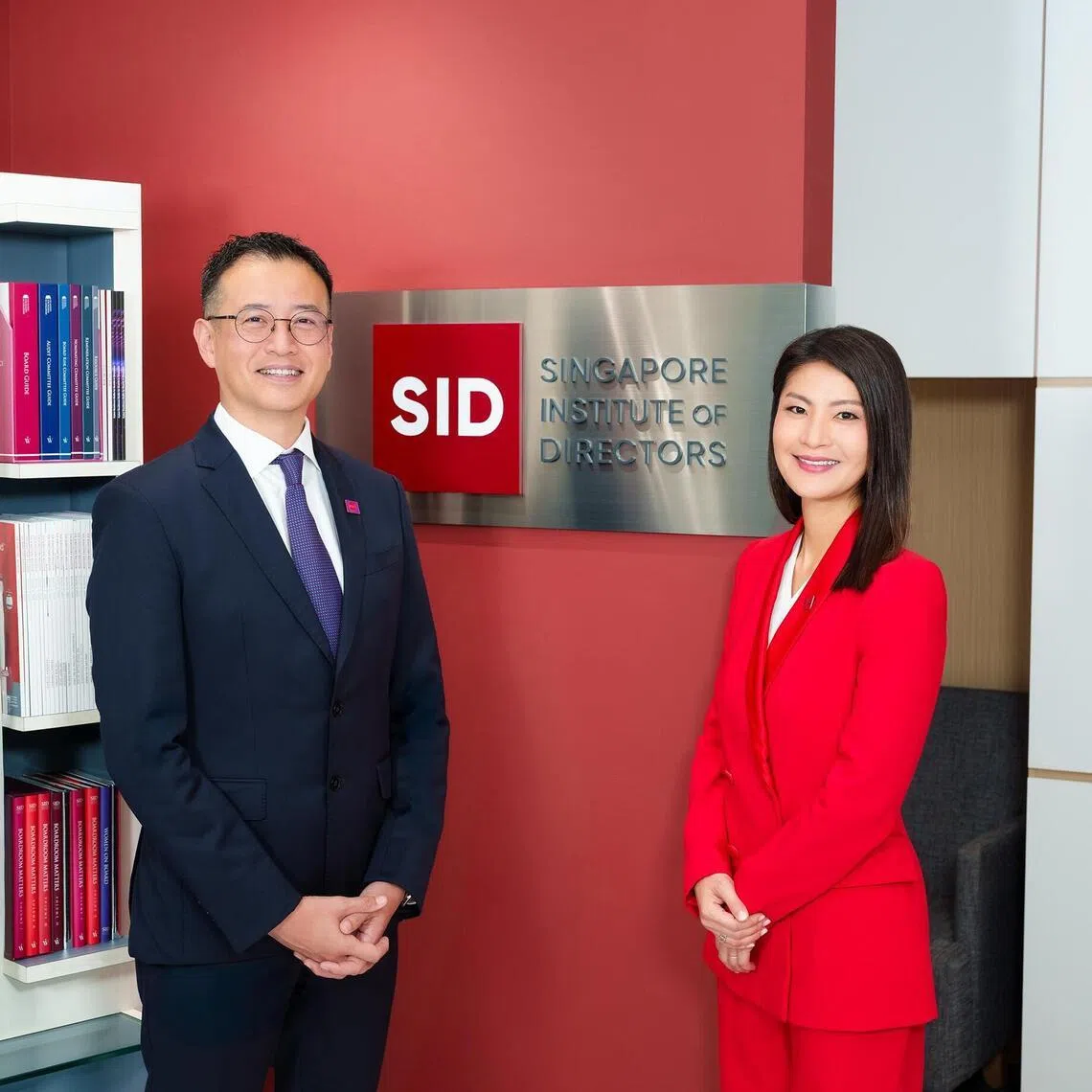 The Singapore Institute of Directors outgoing CEO Terence Quek with CEO-designate Emily Poon who will take over the post on May 1.  Credit: Singapore Institute of Directors