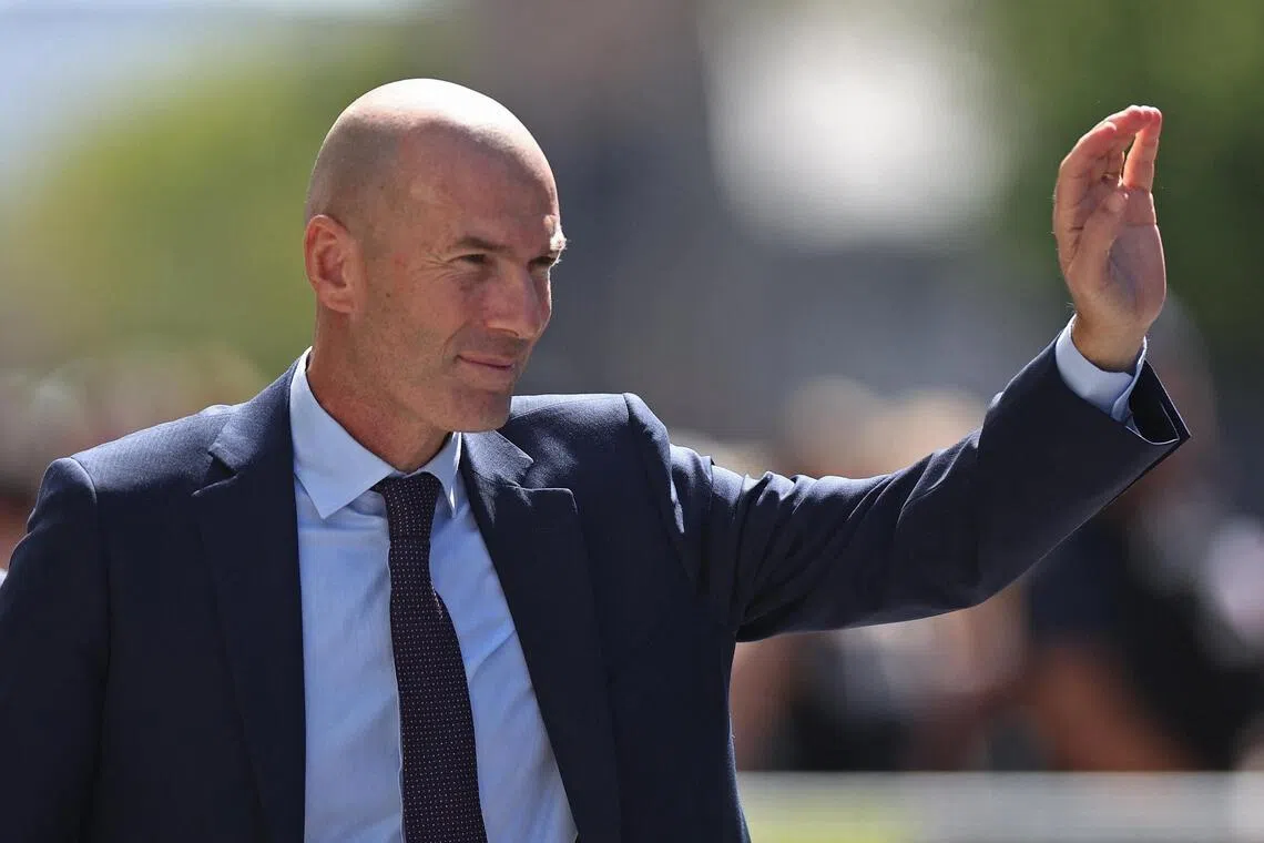 Zinedine Zidane waving at fans as he was unveiled as the newly appointed head coach of France at the French Football Federation headquarters in Paris on July 28.