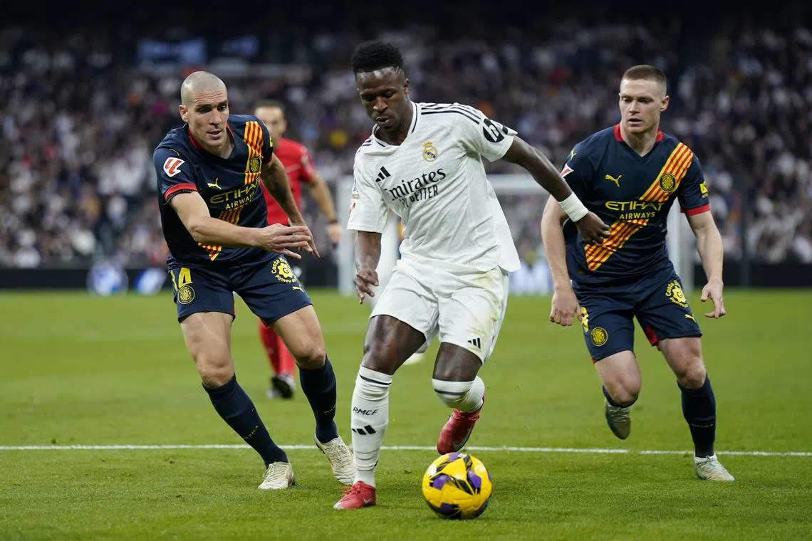 Real beat Girona 2-0 to move level on points with leaders Barcelona | The Straits Times