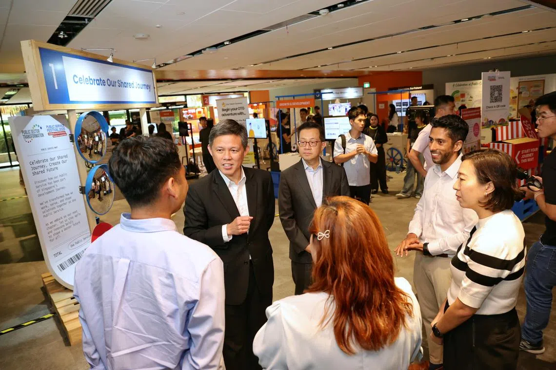 Coordinating Minister for Public Services Chan Chun Sing speaks with award recipients at the Public Service Festival 2025 and Public Sector Transformation Awards Ceremony at One Punggol on July 8.