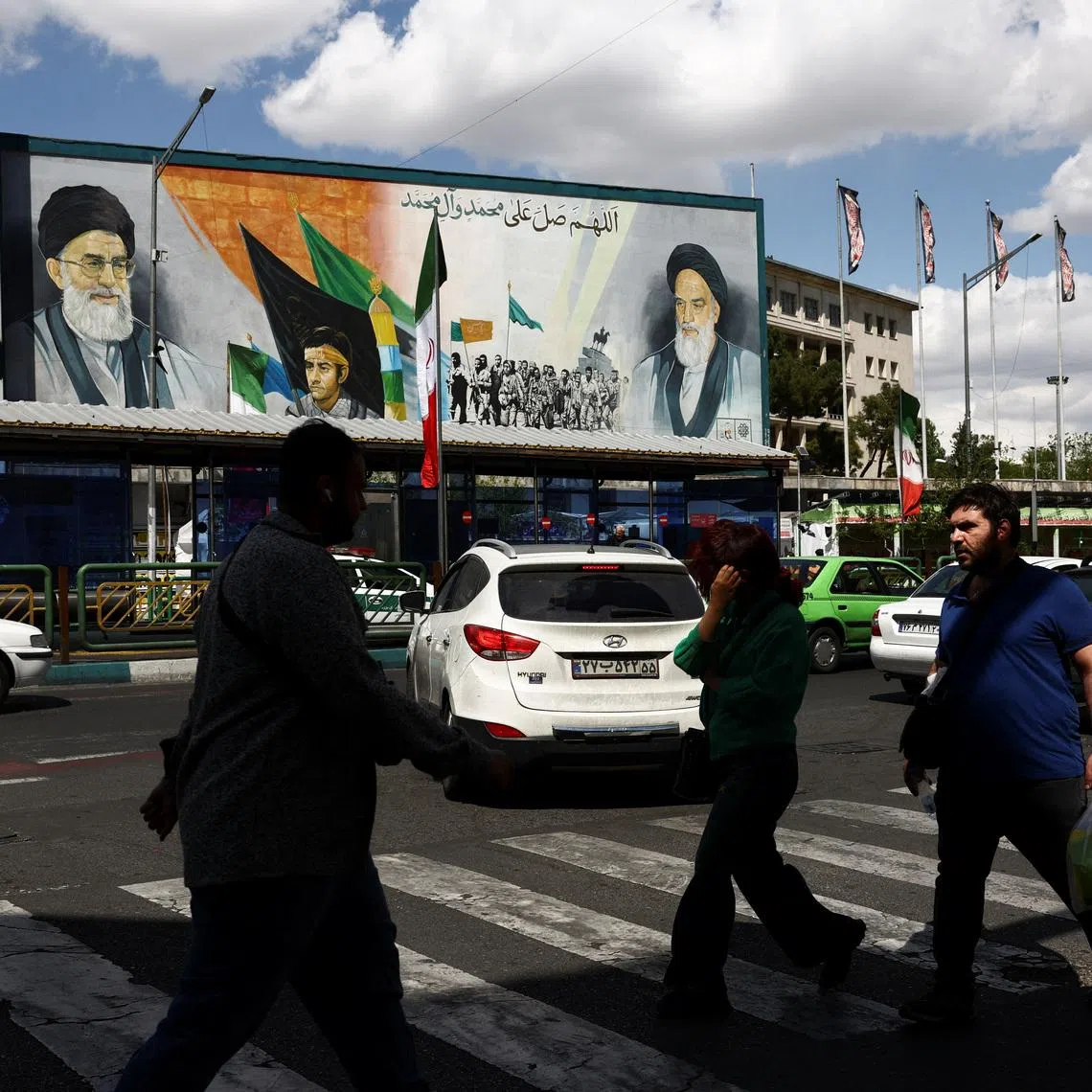 People walk on a street after U.S. President Donald Trump said that he had agreed to a two-week ceasefire with Iran, in Tehran, Iran, April 8, 2026. Majid Asgaripour/WANA (West Asia News Agency) via REUTERS