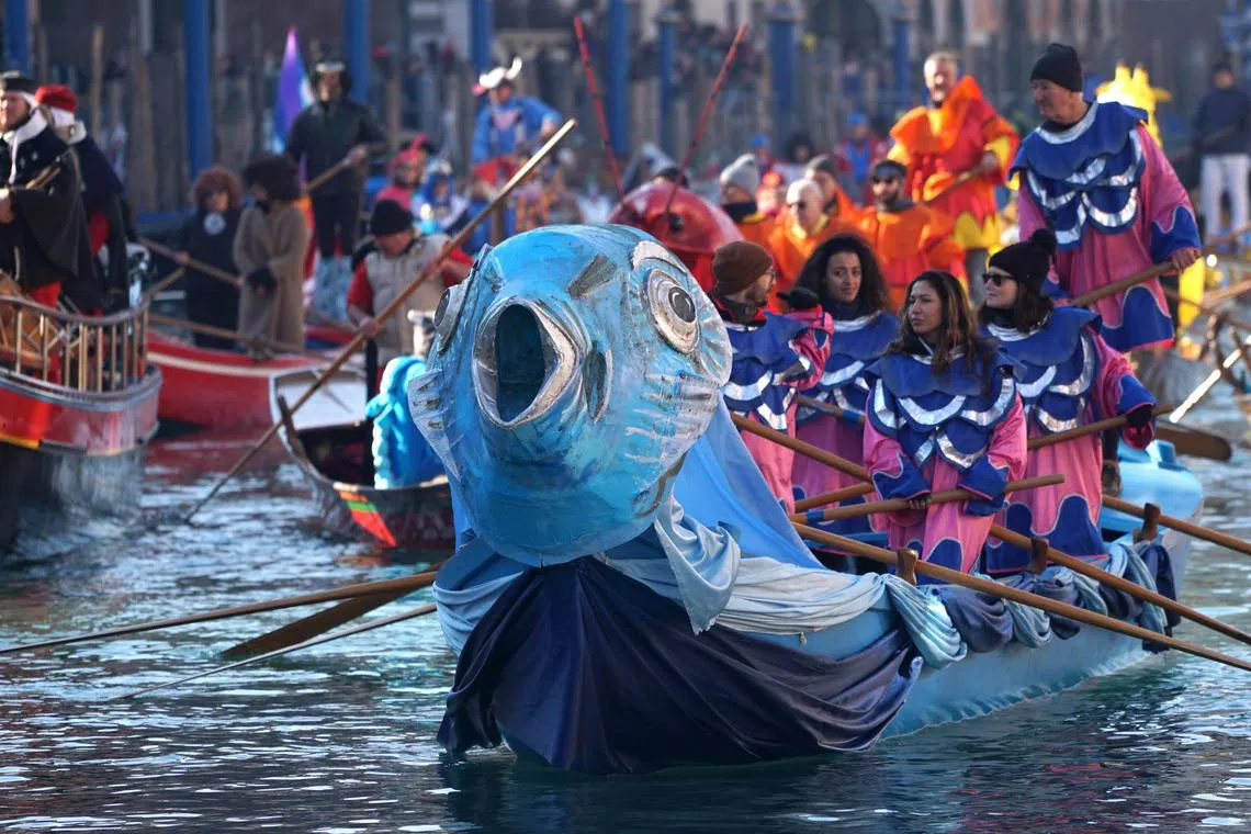 Participants dressed in imaginative and flamboyant costumes rowing animal-shaped boats during the Pantegana Regatta on the Grand Canal, which kicks off the 2024 edition of the Venetian Carnival, in Venice, Italy, Jan 28, 2024.  