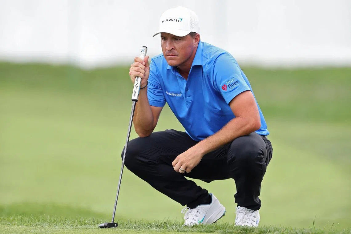 Kevin Roy of the United States lines up a putt on the 18th green during the first round of the Rocket Classic.