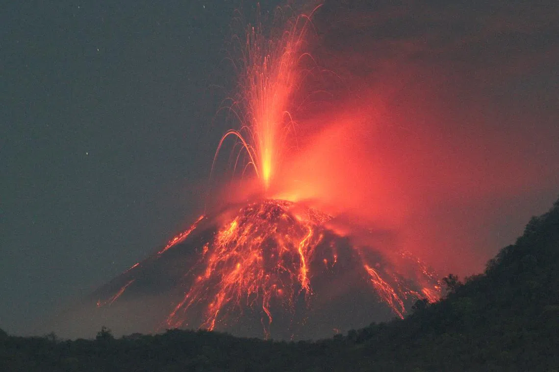 Mount Lewotobi Laki-laki spews volcanic materials during an eruption, as seen from Konga, Titehena, East Flores, East Nusa Tenggara province, Indonesia, November 12, 2024. REUTERS/Stringer
