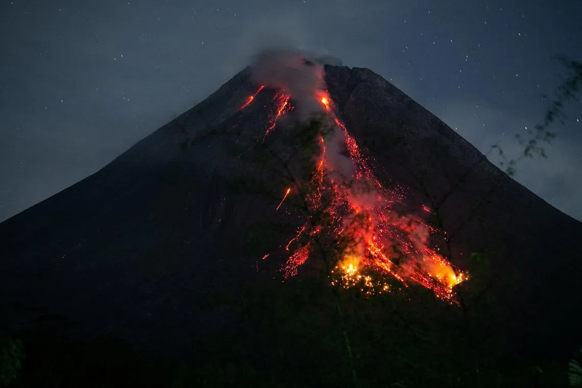 Mount Merapi volcano spews lava and smoke on Dec 12, 2023.