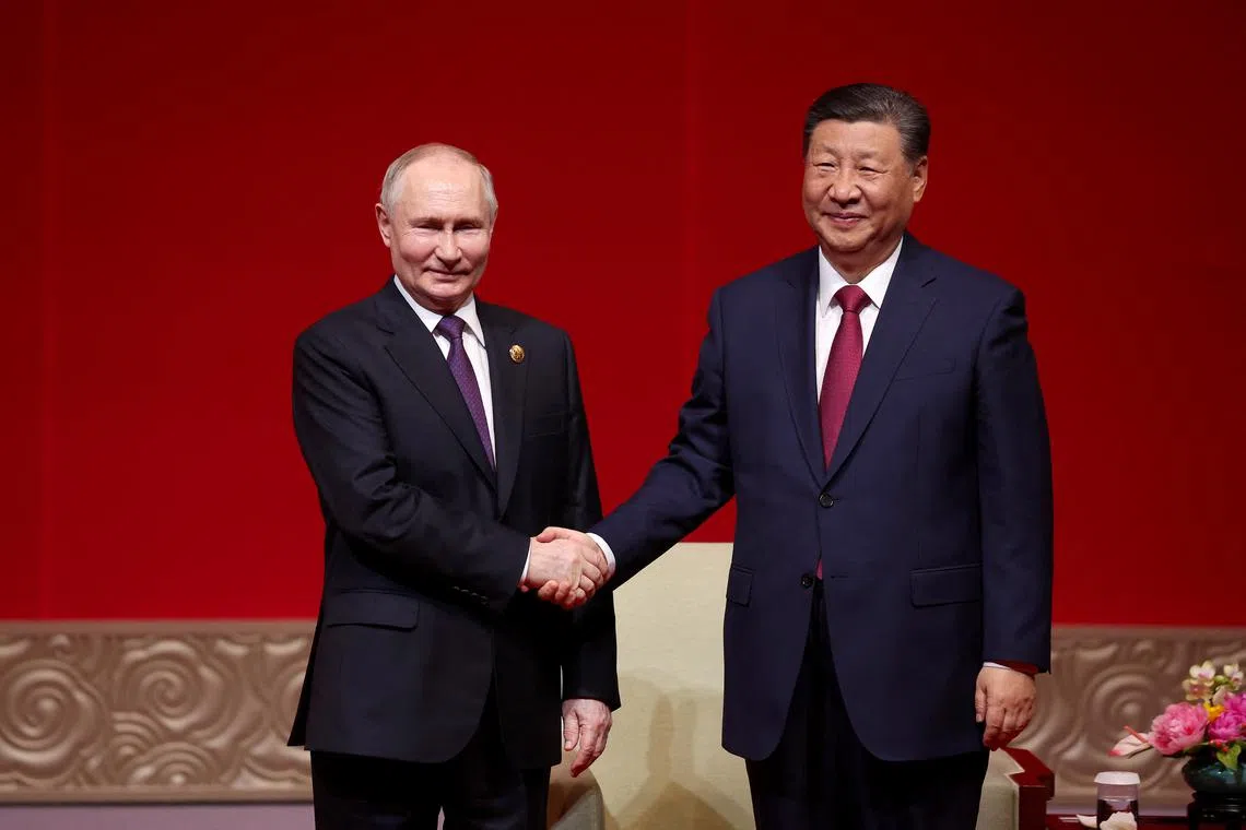 Russia's President Vladimir Putin and China's President Xi Jinping attend a concert at the National Centre for the Performing Arts in Beijing on May 16, 2024. 