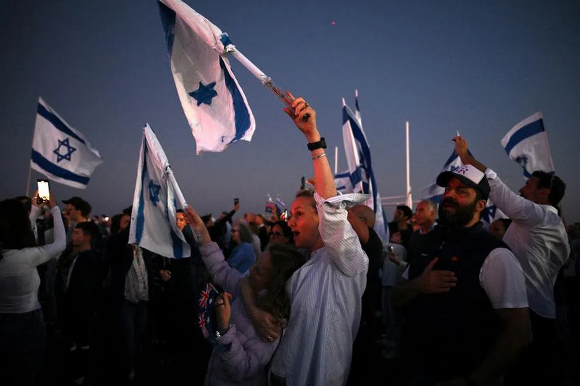 People attend a vigil for Israeli victims at Rodney Reserve in Sydney, Australia October 11, 2023. AAP Image/Dean Lewins via REUTERS