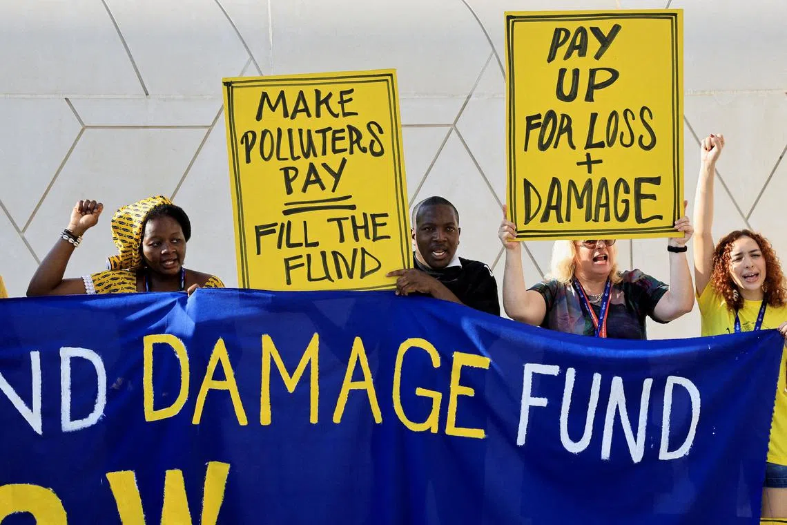 FILE PHOTO: Climate activists protest against fossil fuel emitters, demanding action and more contributions to the Loss and Damage Fund, during COP28 in Dubai, United Arab Emirates, December 4, 2023. REUTERS/Thaier Al Sudani/File Photo